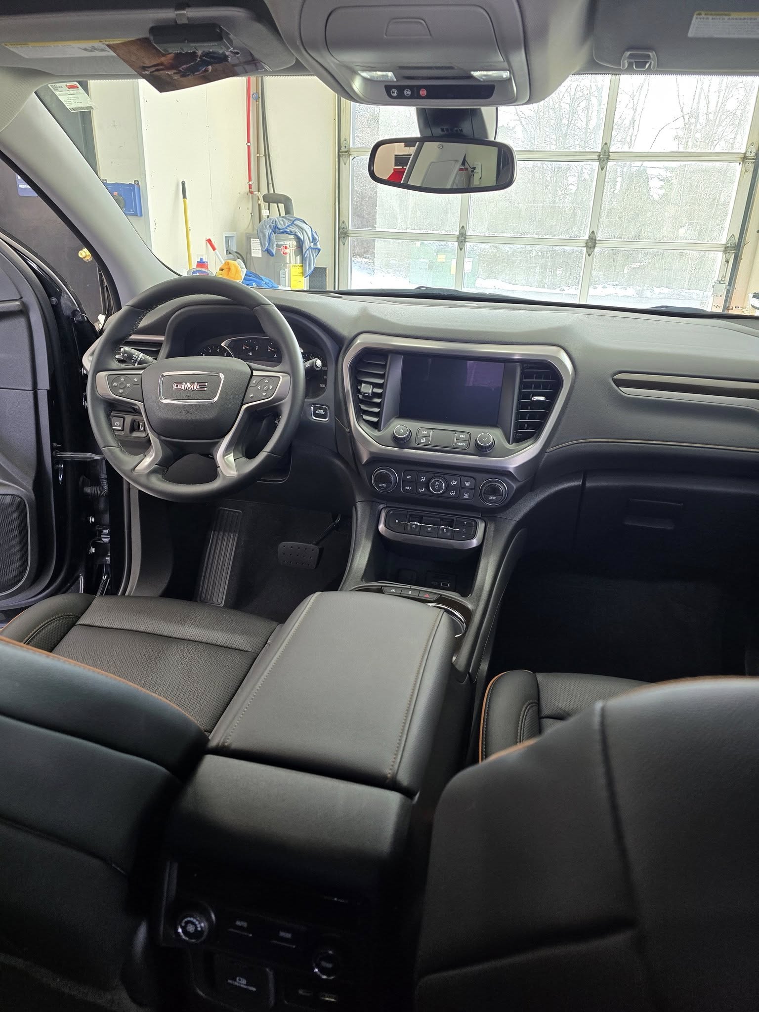 GMC Acadia interior — AFTER (driver area & seat)