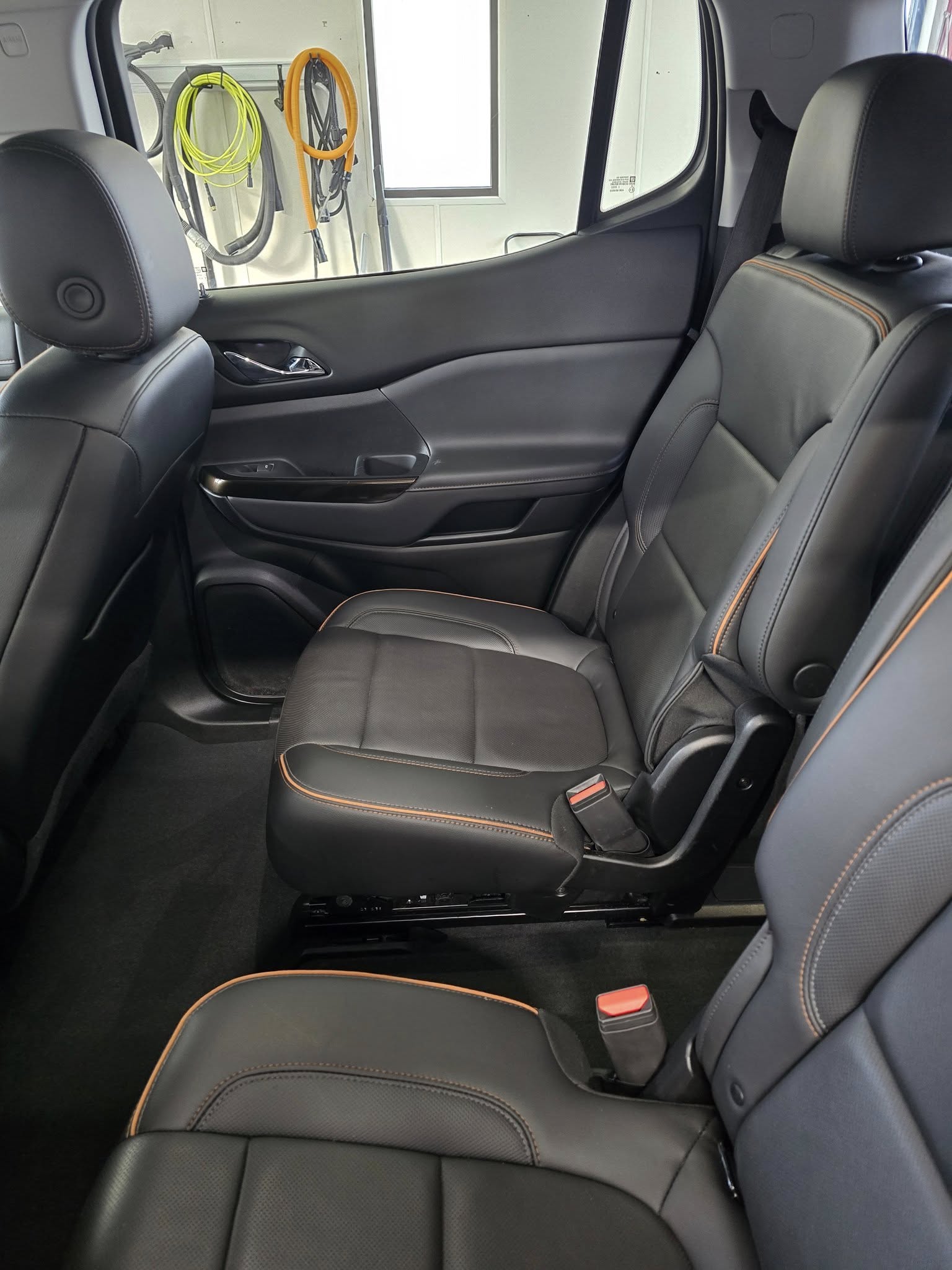 GMC Acadia second-row — AFTER (clean carpets & tracks)