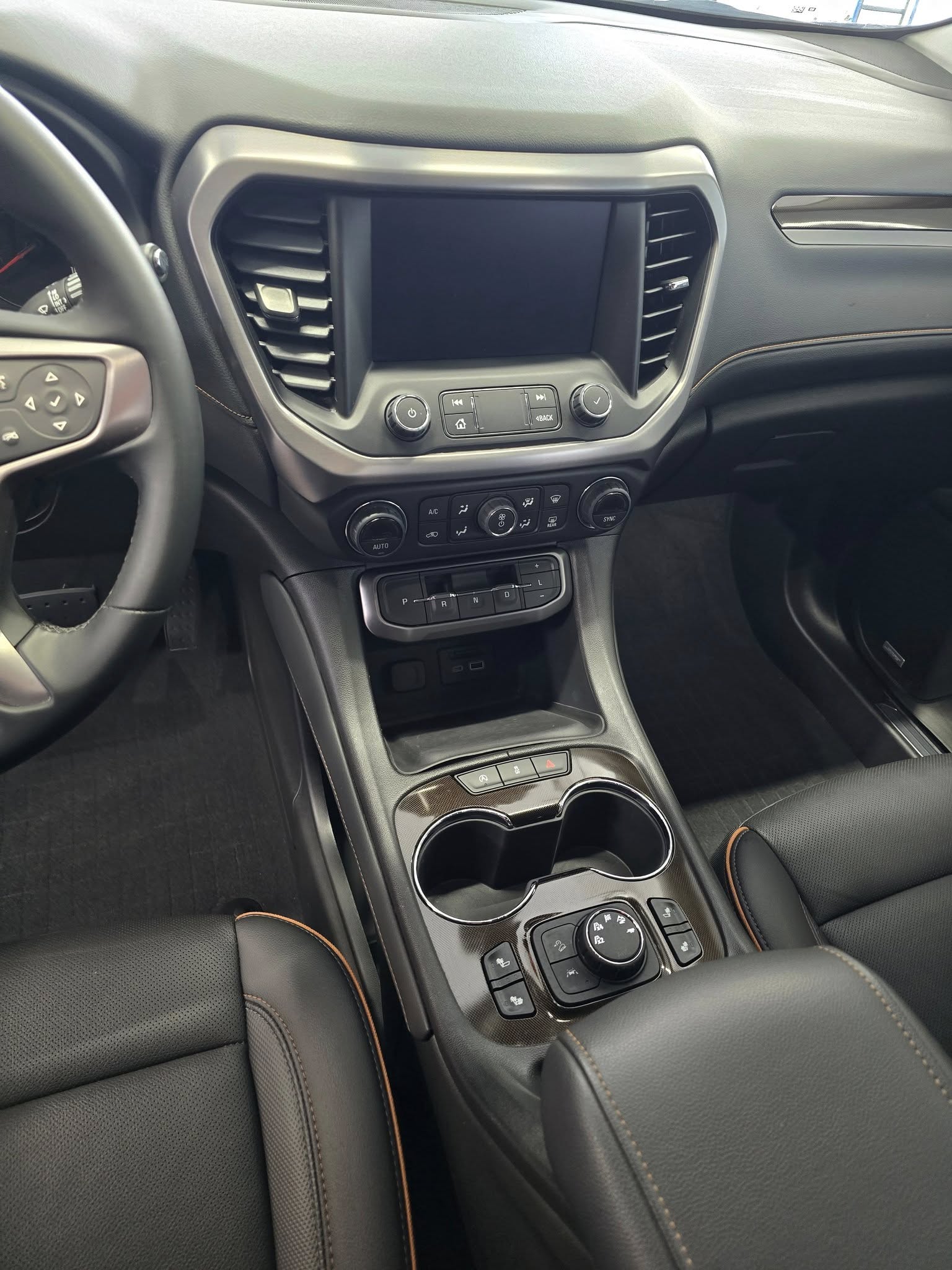 GMC Acadia interior — AFTER (center console, spotless)