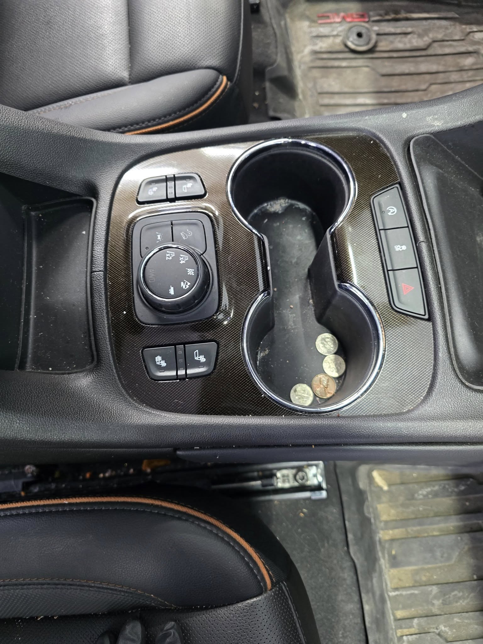 GMC Acadia interior — BEFORE (center console, dirty)